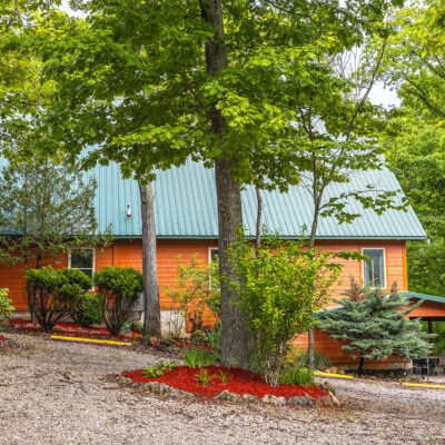 Ozark outdoors cabin behind trees