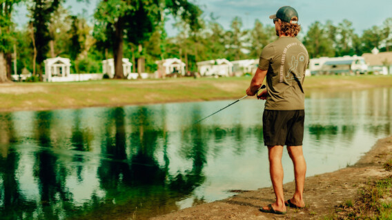 Island oaks man fishing at lake
